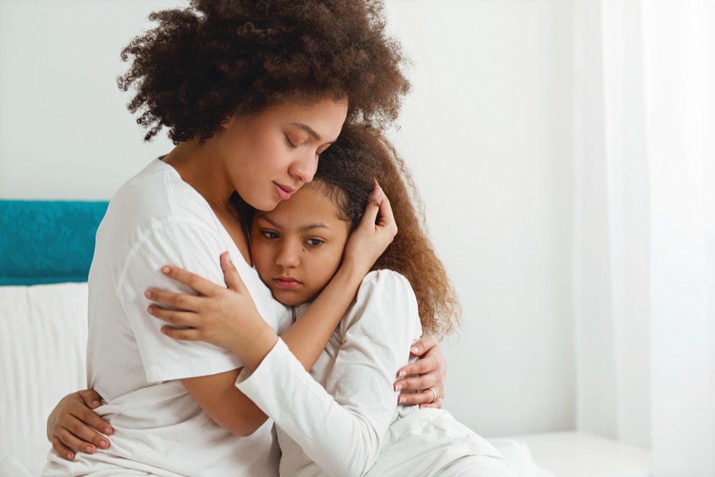 woman comforts sad daughter