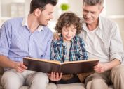 dad son and grandfather reading book