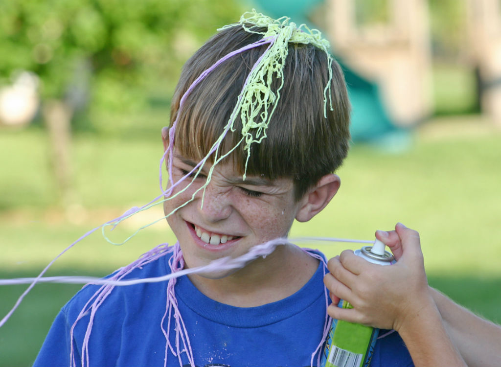 Boy being sprayed with Silly String