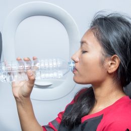 woman drinking water health tweaks over 40