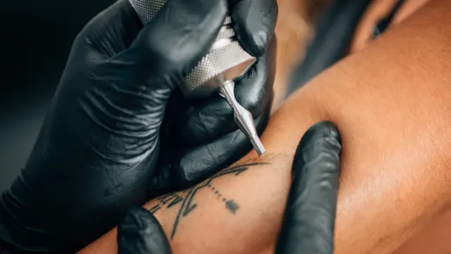 a woman getting first-time tattoos, bad parenting
