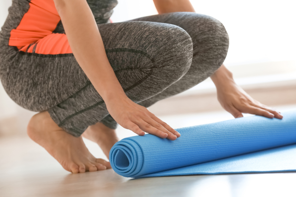 Woman Rolling Up Yoga Mat things you never knew dogs could do