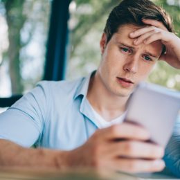 Annoyed worker on his phone