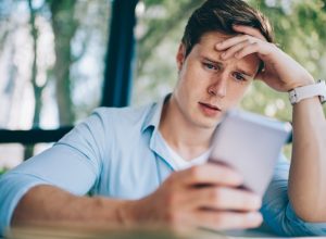 Annoyed worker on his phone