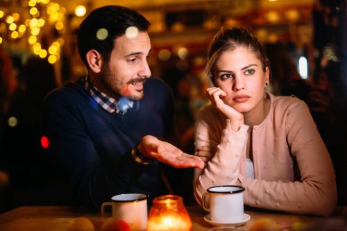 Couple is having relationship problems at dinner