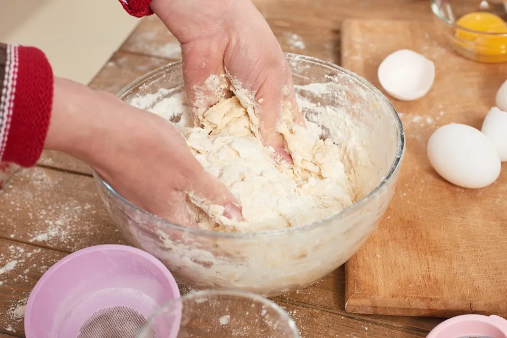 Person is baking and shaping dough