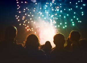 a crowd of people gathered to watch july 4th independence day fireworks