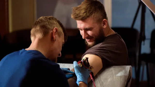 man getting tattoo