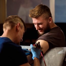 man getting tattoo