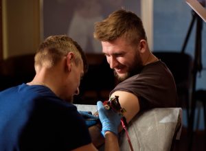 man getting tattoo