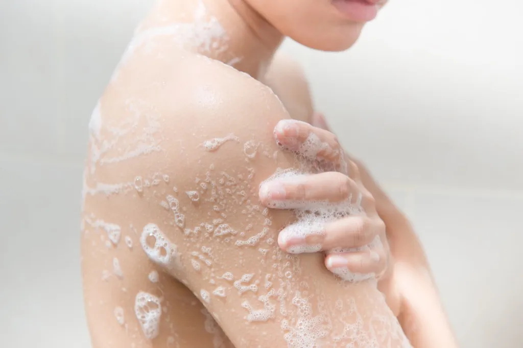 Woman using soap in the shower - commonly misused phrases