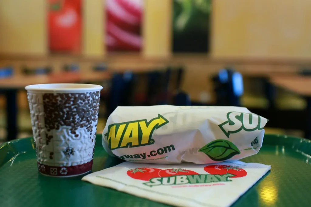 Subway sandwich on tray with coffee