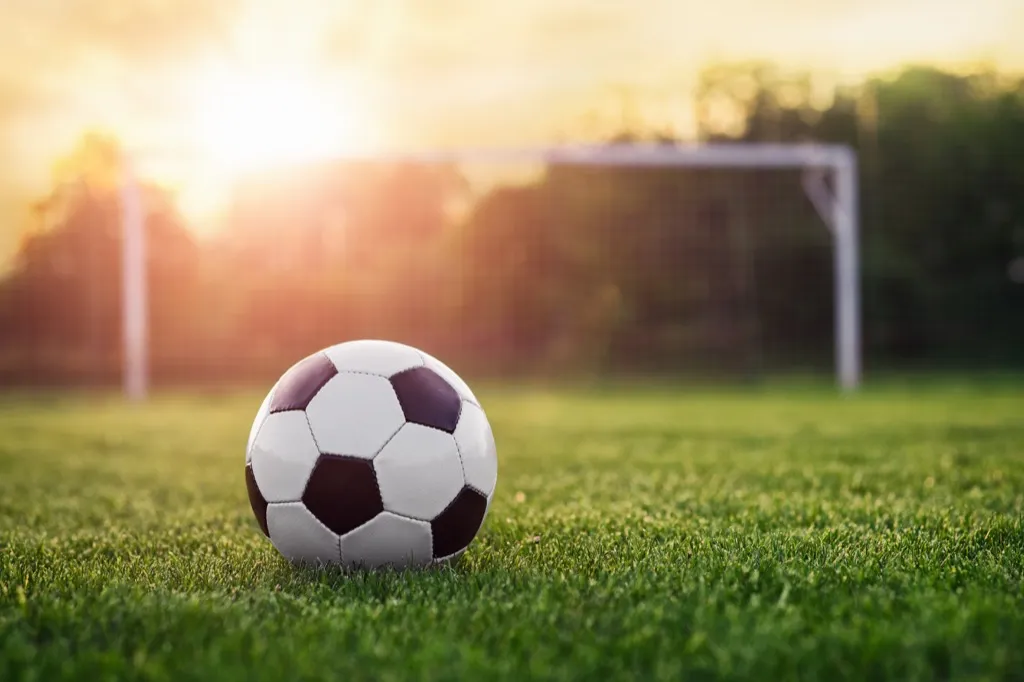 soccer ball against a sunset