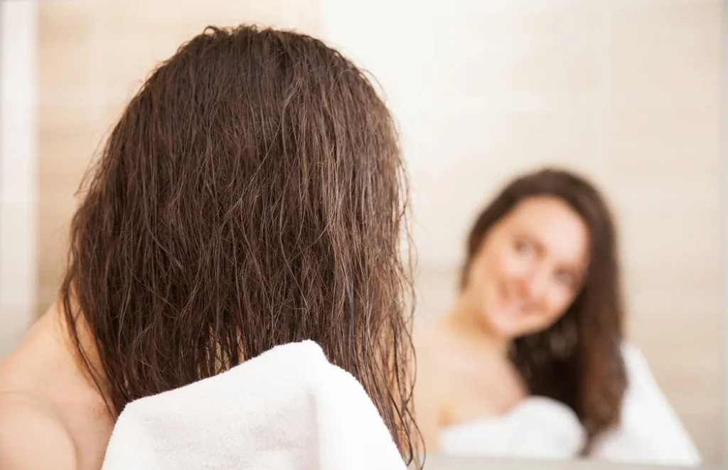 woman with wet hair after shower - what men find attractive in women
