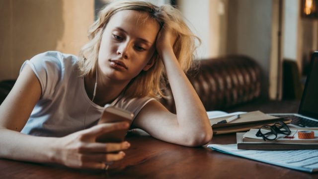 Frustrated Woman on Smartphone