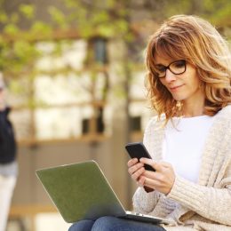 woman working on smartphone and laptop computer, annoying things people do