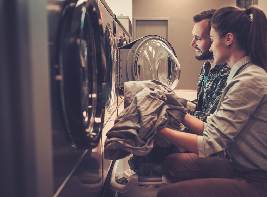Young couple doing laundry