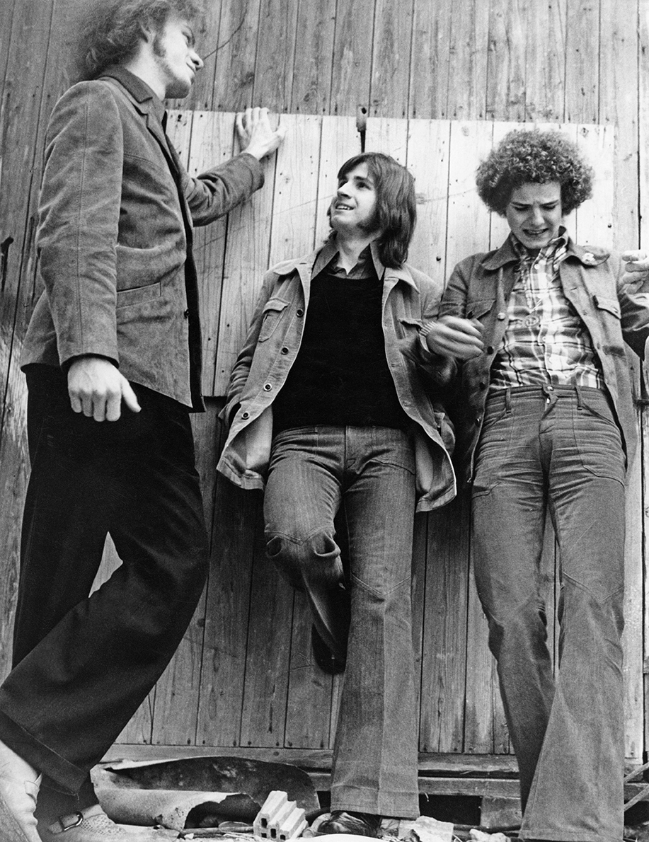 Three teenagers wearing bell bottoms