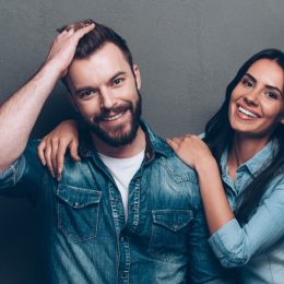 a couple with good hair wearing jean jackets