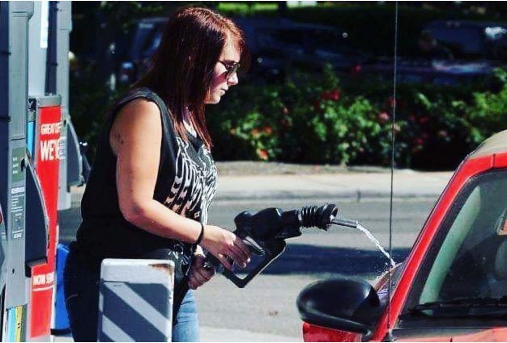 girl pumping gas