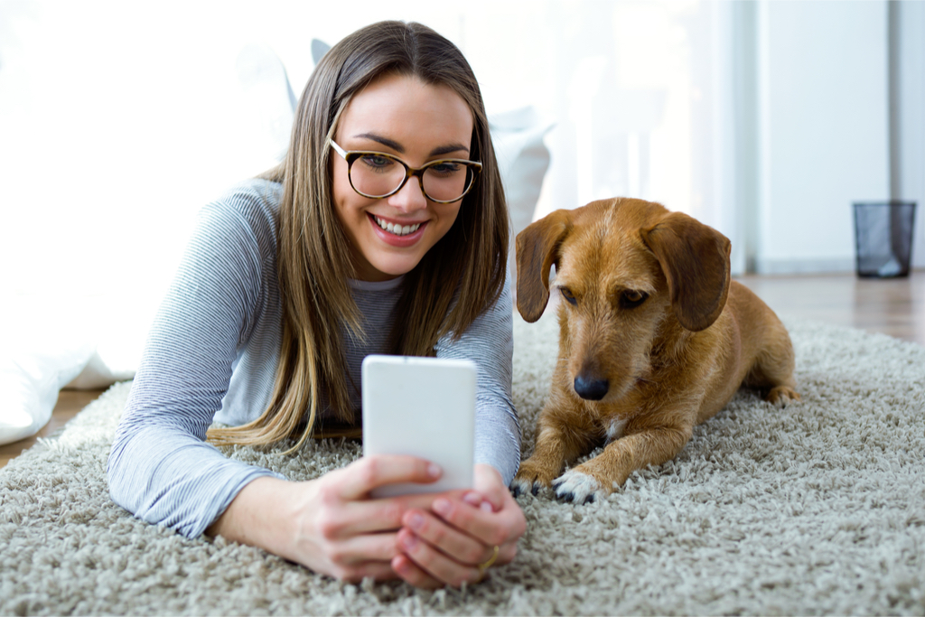 woman taking selfie with dog things you never knew dogs could do