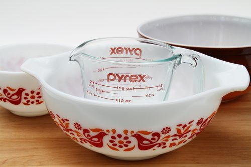 Pyrex measuring cup and vintage patterned mixing bowls.