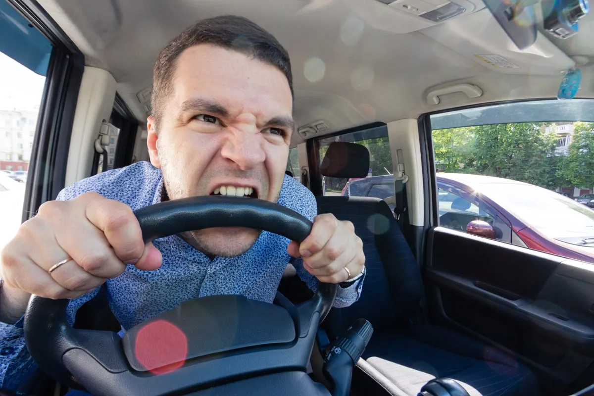 Man Biting a Steering Wheel Commonly Misused Phrases