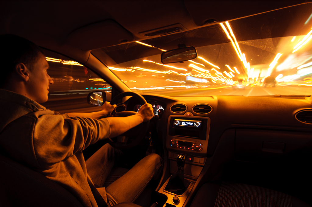 Man driving fast at night