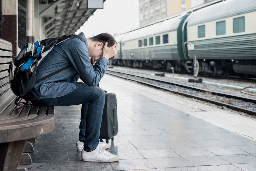 Man with luggage after missing train