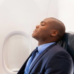 Man sleeping on an airplane