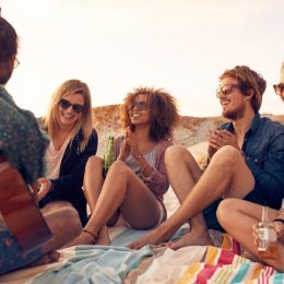 people hanging out on a beach