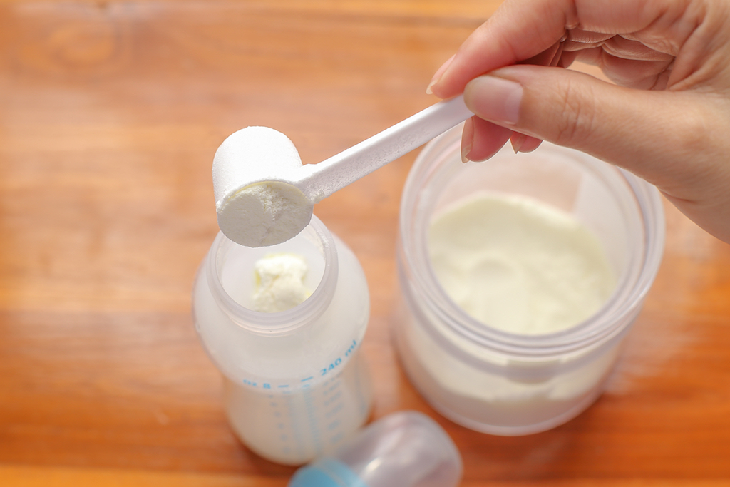 bottle of baby formula, parenting tips