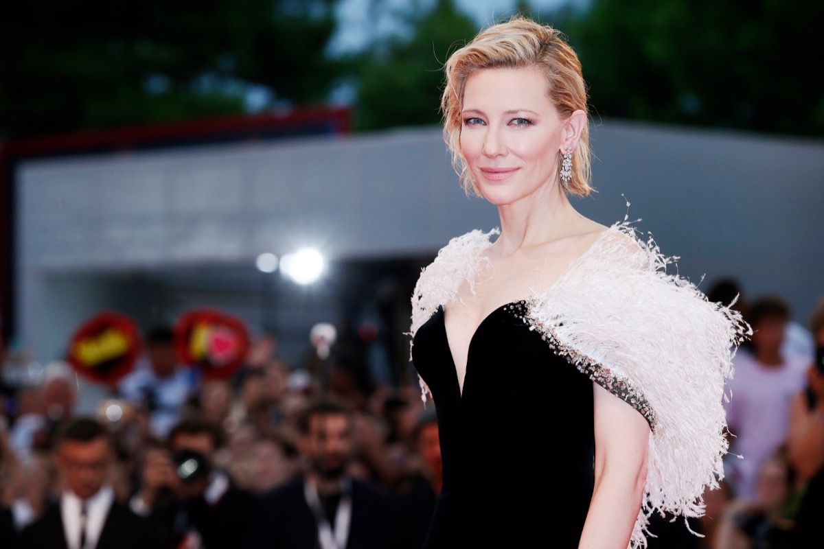 cate blanchett in white fur and a black dress looking more glamorous than anyone else on the planet