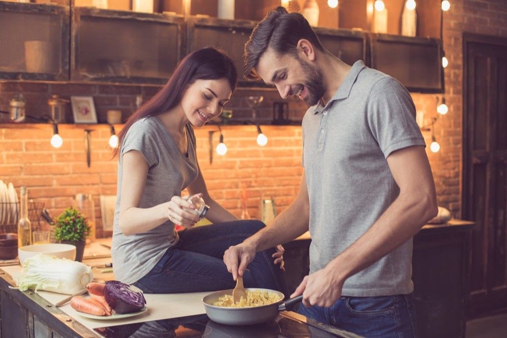 couple cooking dinner in a kitchen