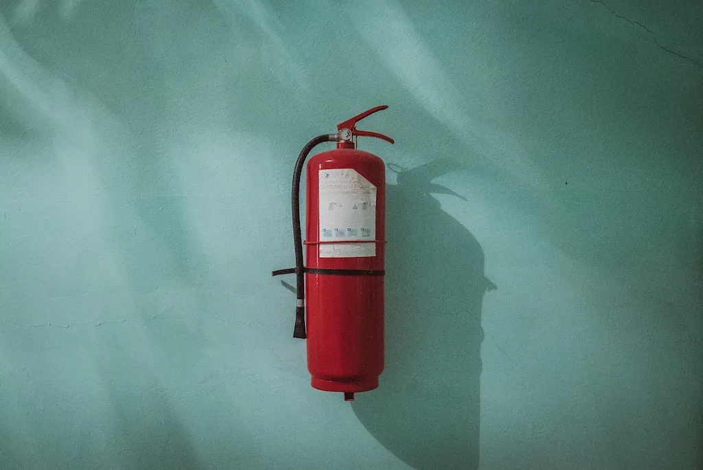fire extinguisher on the wall, things you shouldn't store in your basement