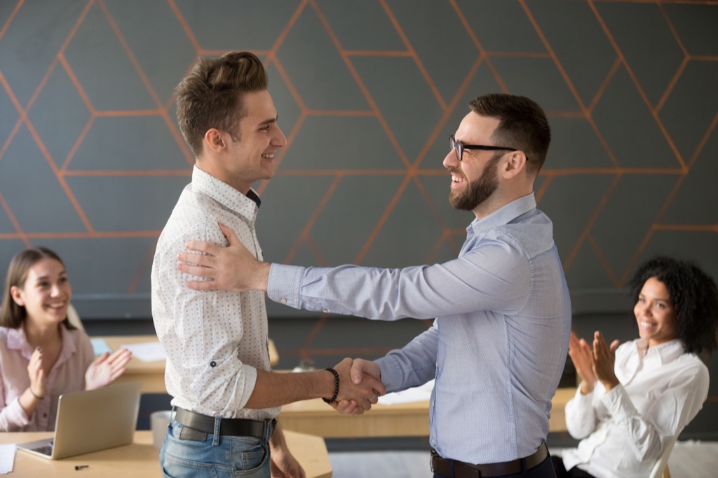 Two Men Shaking Hands Social Etiquette Mistakes