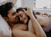 Latino Couple in Bed Reasons Smiling is Good for You how to come harder