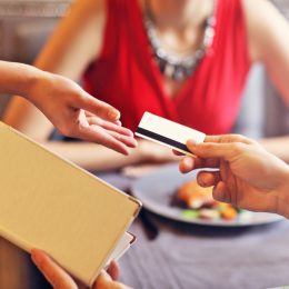 man paying for dinner with a credit card