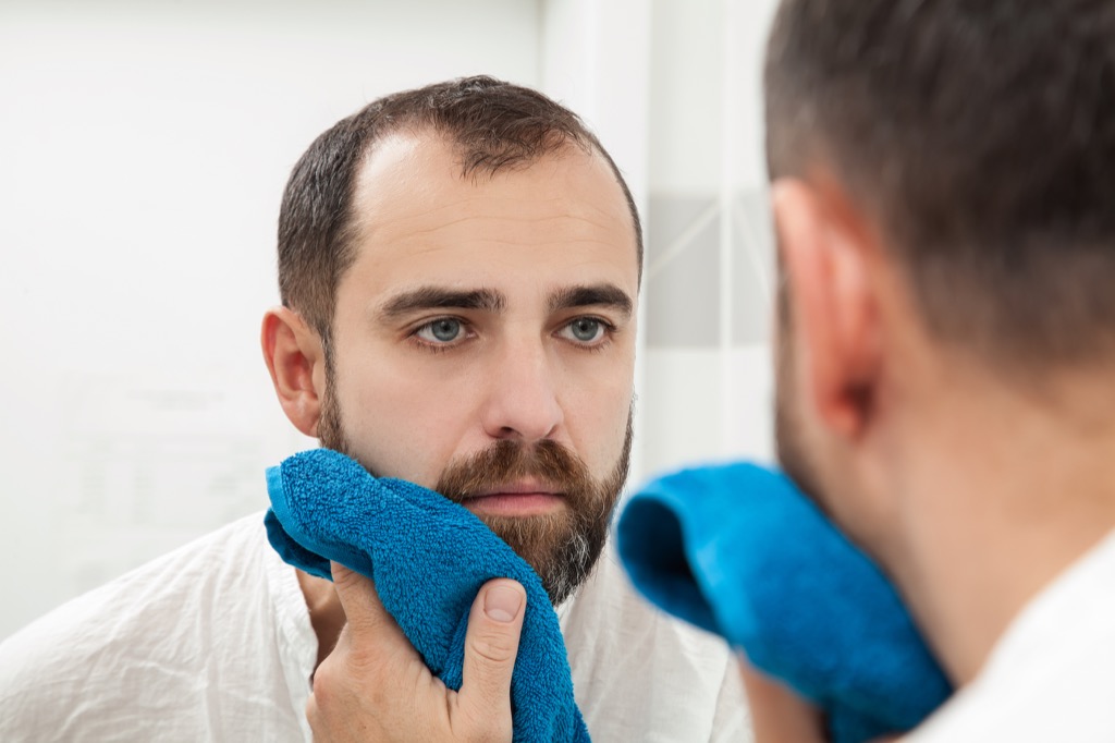 man toweling his beard dry