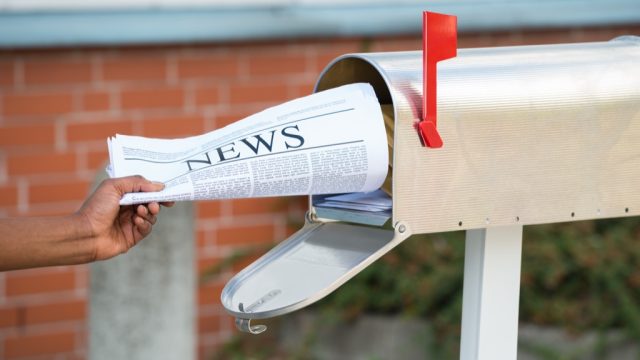 newspaper in mailbox