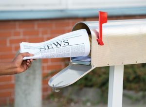 newspaper in mailbox