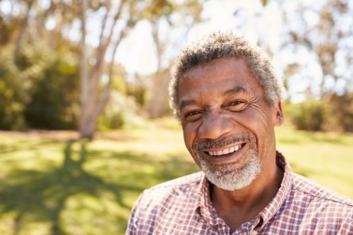 man with gray hair outdoors, look better after 40