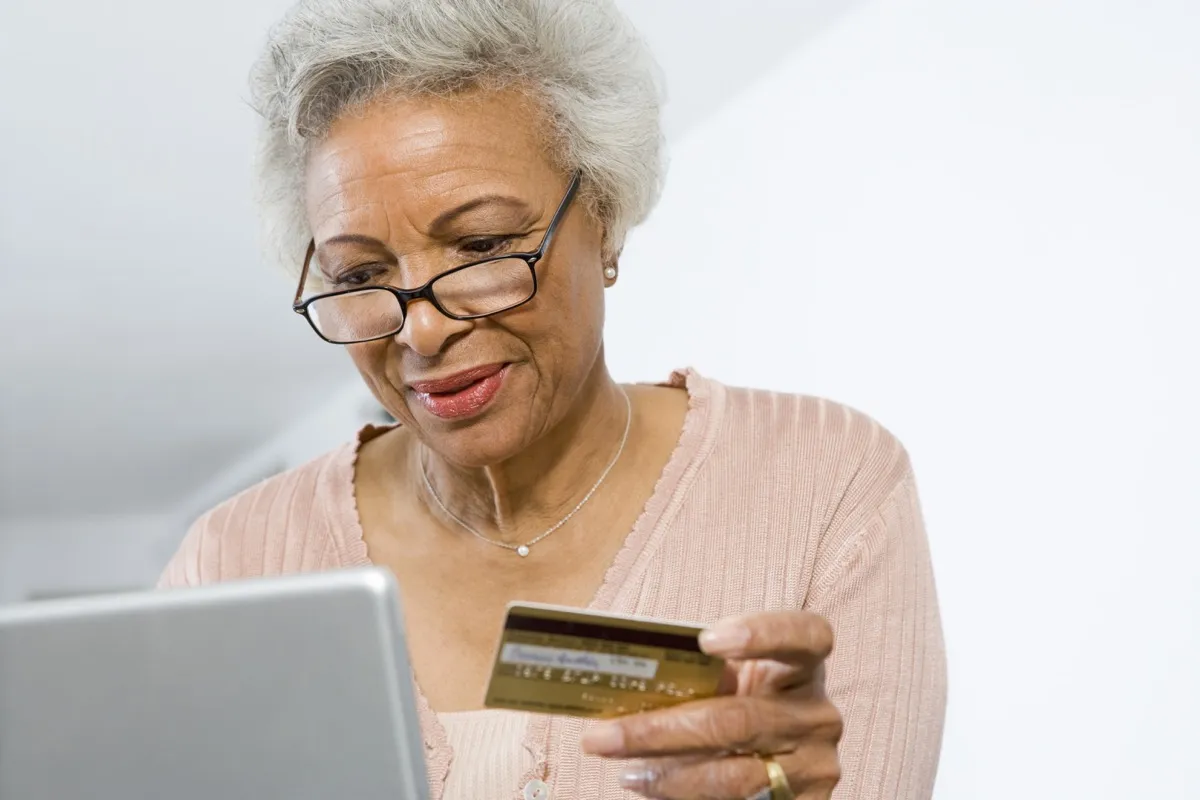 older woman shopping online, empty nest