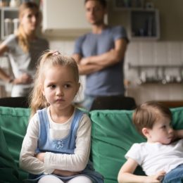 children sitting on couch, parent divorce