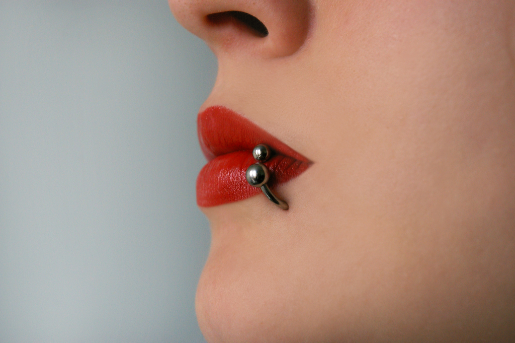 Woman with Lip Piercing Things That Would Horrify Your Dentist