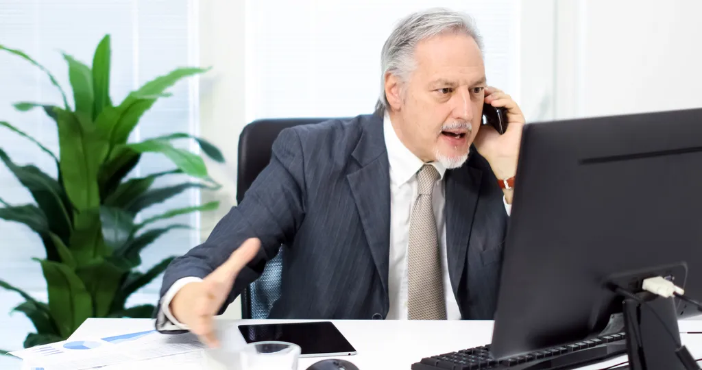 Angry Man Talking to Customer Service Worst Things to Say to Customer Service