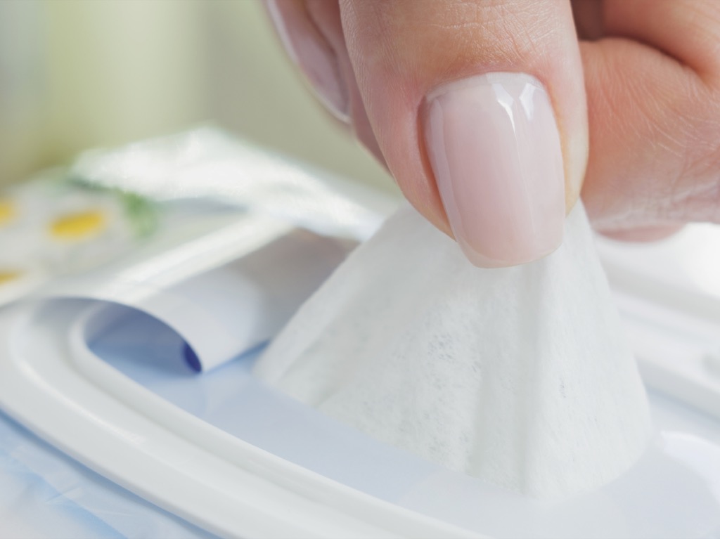 woman pulling out baby wipe, parenting tips