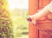 doorknob woman opening door, things you should clean every day
