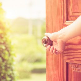 doorknob woman opening door, things you should clean every day