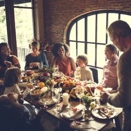 family at thanksgiving dinner - holiday stress